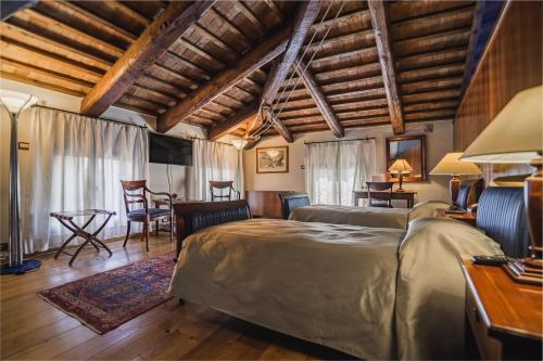 A bed or beds in a room at Le Camere di Palazzo Bortolan