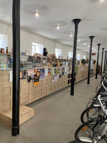 a store with poles in the middle of a room at Penzion Panský dvůr Telč in Telč