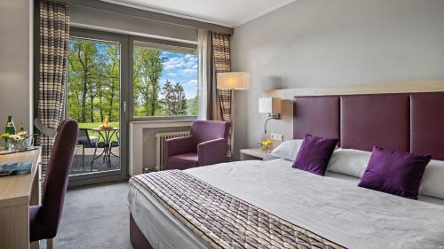 מיטה או מיטות בחדר ב-Hotel Diehlberg