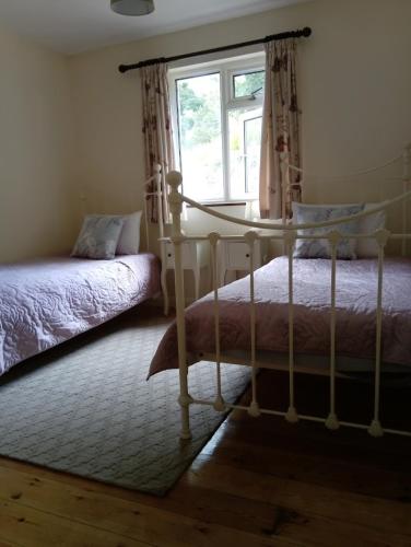 Postel nebo postele na pokoji v ubytování Swanpool Seaside