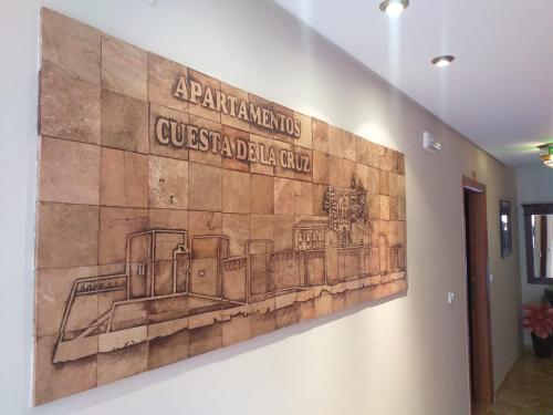 a wall with a drawing of a train on it at Apartamentos Cuesta de la Cruz in Caravaca de la Cruz
