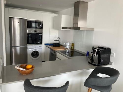 Köök või kööginurk majutusasutuses Appartement Casares - Mer, Golf, Piscine, Padel - FINCA CORTESIN