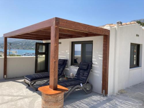 a pergola on the back of a house at Lilian Loft Sea View - Adults Only in Plakias