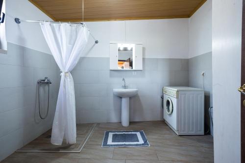 a bathroom with a sink and a toilet and a shower at Villa Margarita's farm, private pool in Maláthiros