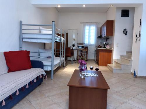 a living room with a couch and a bunk bed at Comfy Alykes Apartment, Volos in Volos