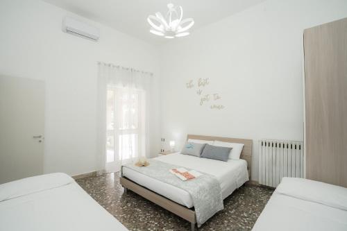 Postel nebo postele na pokoji v ubytování Meraviglia d'Otranto
