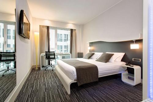 Кровать или кровати в номере Best Western Premier Hotel Royal Santina