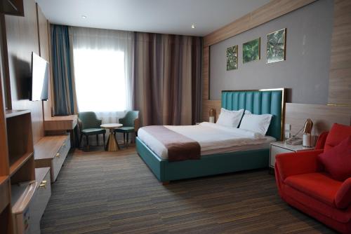 Ένα ή περισσότερα κρεβάτια σε δωμάτιο στο Taij resort hotel