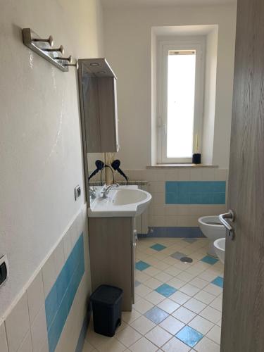 a bathroom with a sink and a toilet at La Maremmana in Talamone