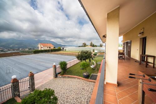 a balcony with a view of the water at Gaia Albenga in Albenga