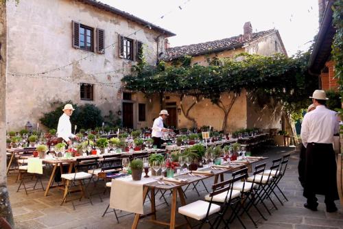 a group of people standing around a table with plants on it at Il Borro Relais & Châteaux in San Giustino Valdarno