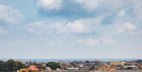a view of a city with a cloudy sky at Gaia Albenga in Albenga