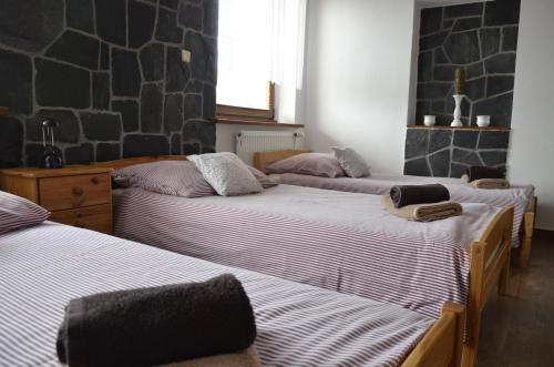 Cama ou camas em um quarto em Penzion Eva