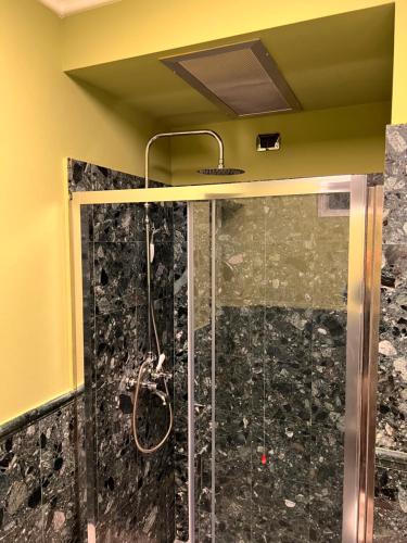 a shower with a glass door in a bathroom at Villa Camilla Milano in Milan