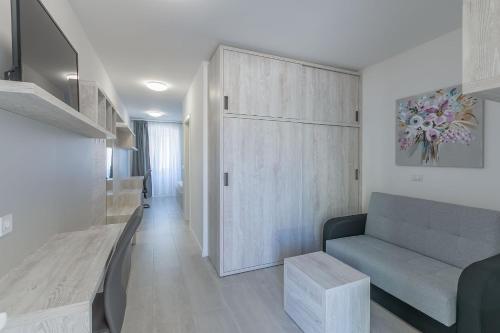 a living room with a couch and a cabinet at B&B-Ld in Pula