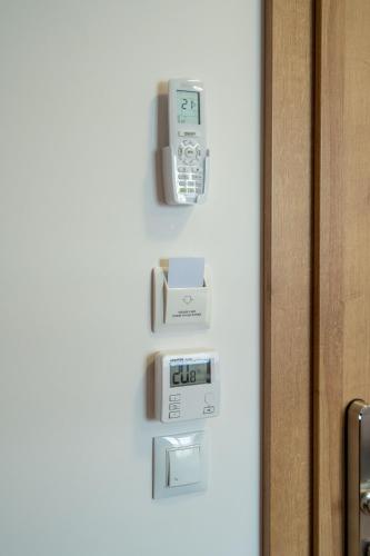 a wall with an electronic device on a wall at HAPPY81 noclegi - 3,5km Energylandia in Zator