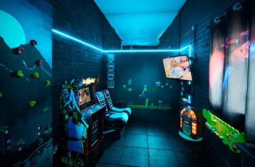 a room with a video game room with blue lights at Popular with families - Cinder Hill in Whitby