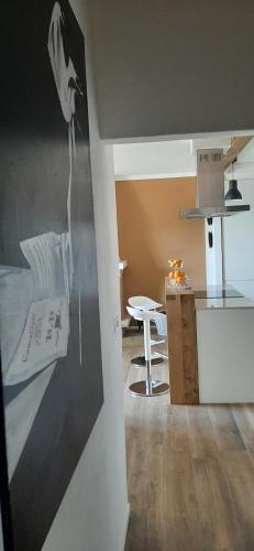 a room with a kitchen with a bed and a table at B&B degli Allori in Moggiona