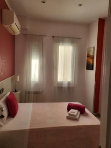 a small room with a white bed and a white dresser at Hostal Inn Madrid in Madrid