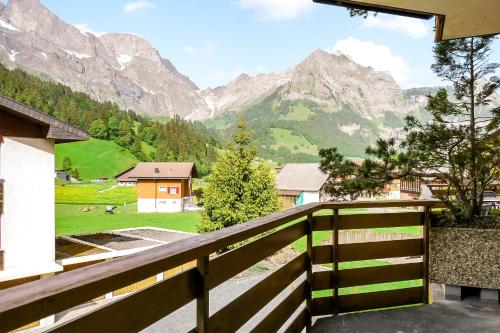a balcony with a view of a mountain at Apartment next to Titlis Station in Engelberg
