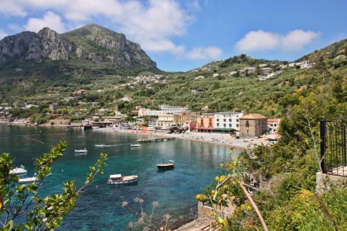 a view of a beach with boats in the water at Mim&igrave; sul Mare in Massa Lubrense