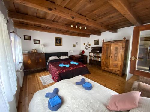 Un pat sau paturi într-o cameră la Hétmérföldes Vendégház