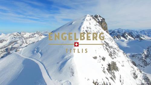a snow covered mountain with the words ingelborg hills at Apartment next to Titlis Station in Engelberg