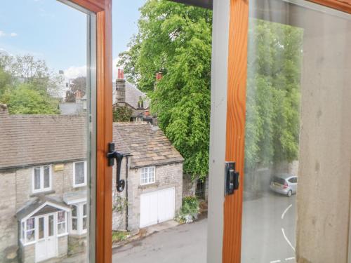 an open window with a view of a street at Billy Whiskey's in Tideswell