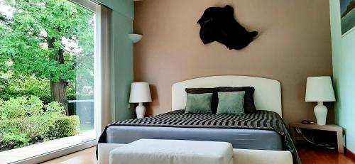 A bed or beds in a room at B&B prince d’Orange Waterloo
