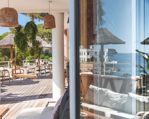 a view of the ocean from the balcony of a hotel at Hotel de La Plage - Mahogany in Cassis