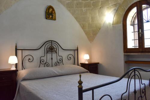Un pat sau paturi într-o cameră la Trulli Monte Madre