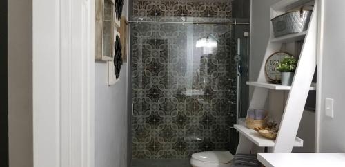 a bathroom with a shower with a toilet at Charming Country Retreat Home in Clermont