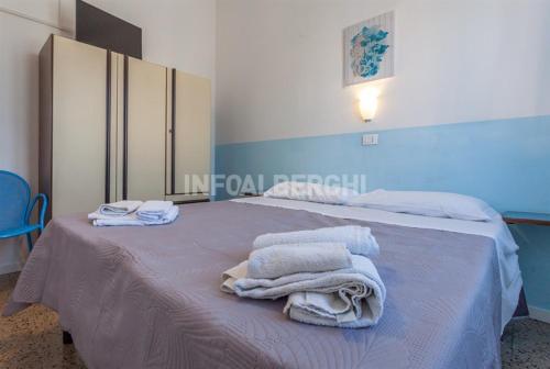 Postel nebo postele na pokoji v ubytování New Hotel Villa Enea