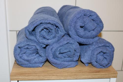 a pile of towels sitting on top of a table at Apartment D&E Punat - free Wi-Fi and parking in Punat