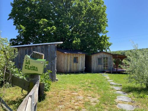 a sign on a fence in front of a building at Kerca Bio Farm in Kercaszomor