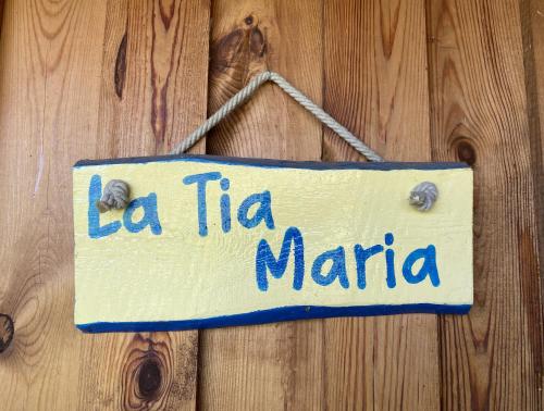 a sign that says la tilia maria hanging on a wooden wall at Kerca Bio Farm in Kercaszomor
