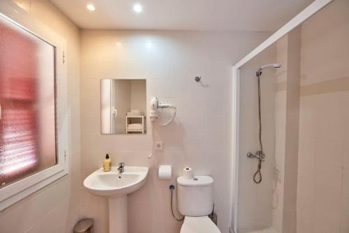 a bathroom with a toilet and a sink and a shower at Nura Houses Duplex Magaluf 4 in Magaluf