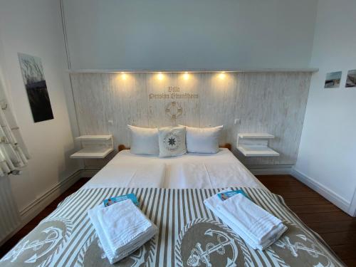 En eller flere senge i et værelse på Villa Pension Strandhaus - adults only
