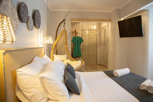 Ένα ή περισσότερα κρεβάτια σε δωμάτιο στο Glykeria Mini Suites
