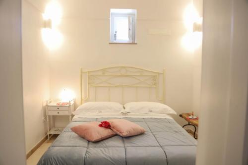 Postel nebo postele na pokoji v ubytování TRULLI CALELLA by Apulia Hospitality