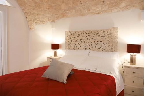 Postel nebo postele na pokoji v ubytování TRULLI CALELLA by Apulia Hospitality