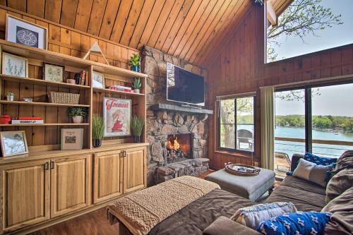 a living room with a couch and a fireplace at Serene Lakefront Escape Boat Dock and Grill! in Twin Lakes