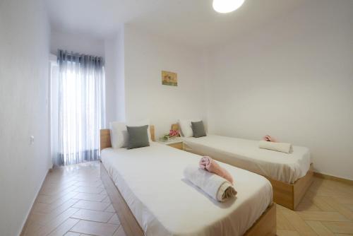 Katil atau katil-katil dalam bilik di Anesis Seaview Apartment