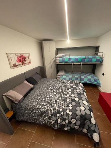 a bedroom with two bunk beds in a room at CASA ANGELA in Dervio