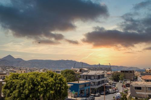 a view of a city with a kite in the sky at Sunrise Apartment in Heraklio Town