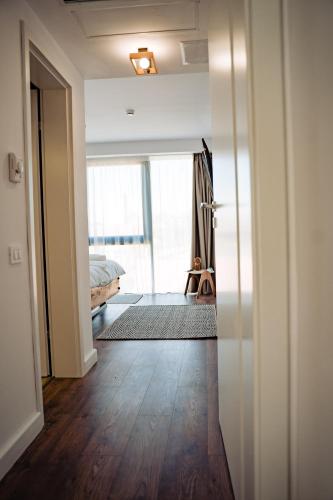 an open door to a bedroom with a bed in a room at Hotel B4 in Oradea