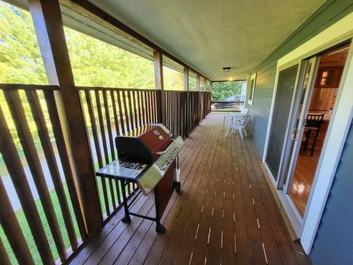 a screened in porch with a laptop on a table at Hibernation Haven in McHenry