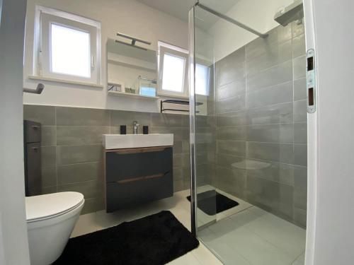 Kúpeľňa v ubytovaní Apartman Dominic
