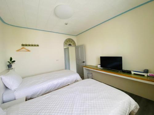 Ένα ή περισσότερα κρεβάτια σε δωμάτιο στο Good moment B&B