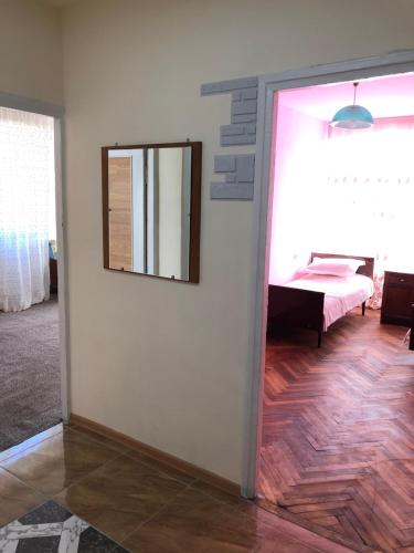 a room with a mirror on a wall and a table at Apartment in Alaverdi in Alaverdi
